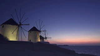 美丽的日落在著名的米科诺斯岛，希腊的风车视频素材模板下载