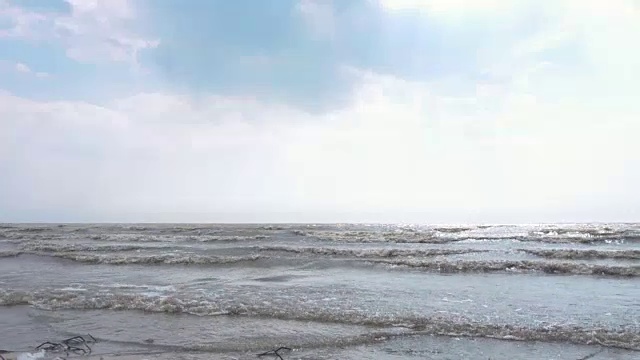 Coast of Baltic sea in sunny autumn day. Footage. View of the waves of the sea in autumn