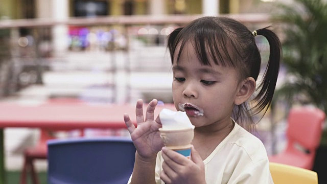 Happy Little Girl Eat Ice Cream